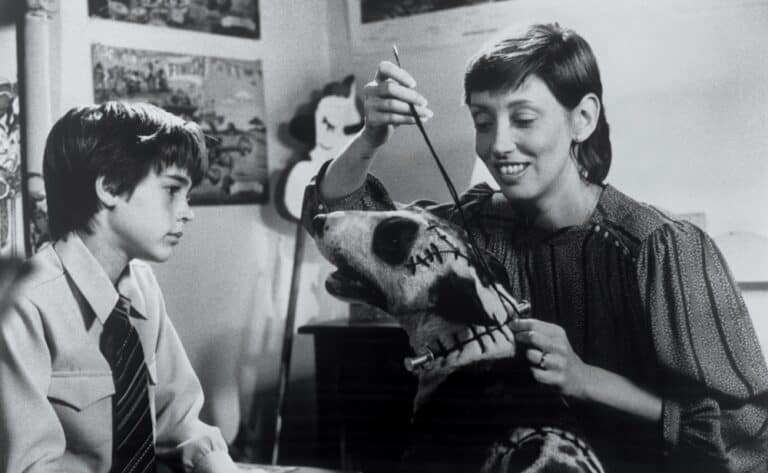 Frankenweenie (1984) directed by Tim Burton. Victor (left) watches as his mother (right) takes his dog Sparky's lead.