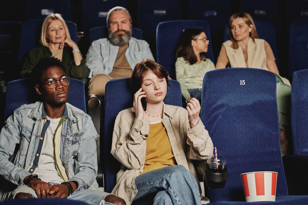On mobile phone during film screening