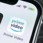 Netflix and Prime logos on a smartphone