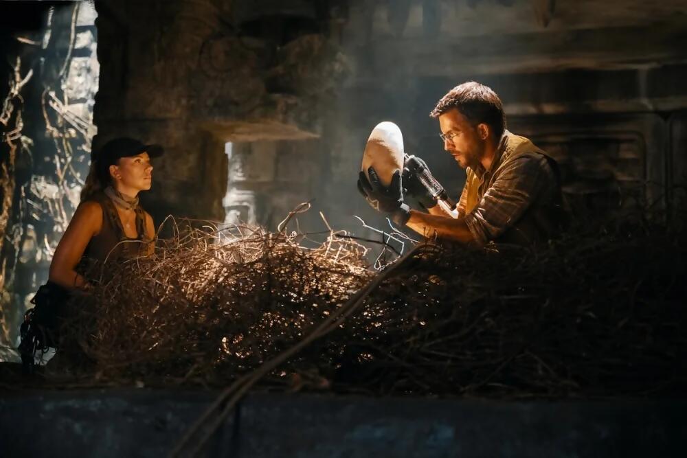 jurassic world rebirth cast look at a dinosaur egg