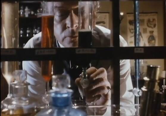 Michael Caine with test tubes