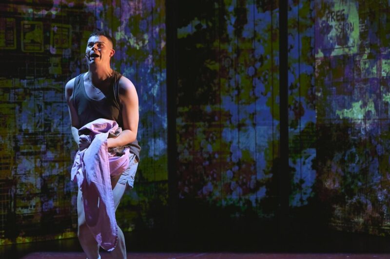 Spud clutching a soiled sheet in Trainspotting The Musical